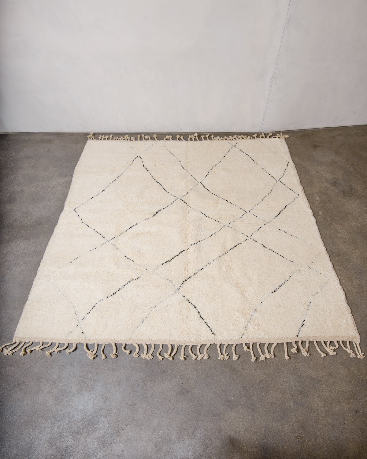 Modern, designer, handcrafted Berber rug from Morocco. Beniourain carpet with minimalist design, natural wool pile and a fluffy texture.